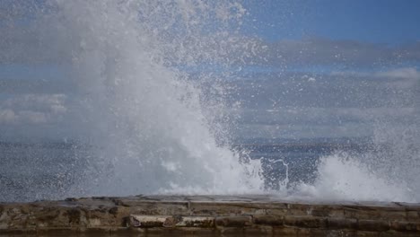 Wave-crashing-against-seawall-in-Pacific-Grove-California