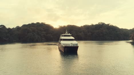 Drone-footage-during-sunset-from-an-elegant-boat-anchored-at-big-river