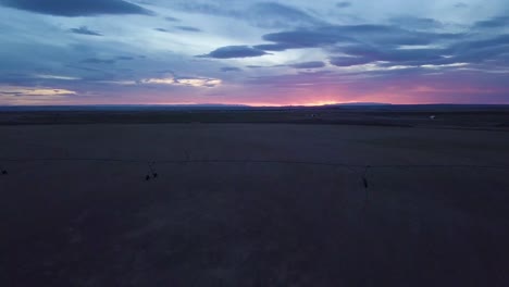 Drone-flying-over-a-field-in-southern-Colorado-in-the-late-evening