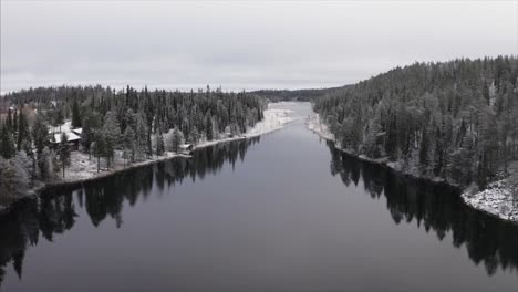 A-DRONE-FOOTAGE-OF-A-LAKE-AFTER-SNOWFALL