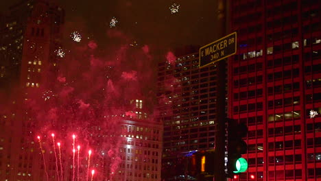 The-Wacker-Street-Sign-in-Chicago-is-backlit-by-a-frenzy-of-white-and-red-fireworks-in-slow-motion