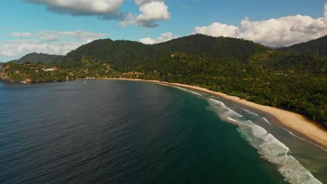 Longest-strip-of-sand-on-a-Caribbean-island-with-mountains-in-the-background