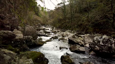 Public-footpath-along-the-River-Glaslyn,-near-Beddgelert,-North-Wales,-Gwynedd,-Snowdonia-National-Park,-Wales,-UK