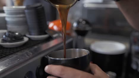 Slow-motion-barista-close-up-pouring-cold-coffee