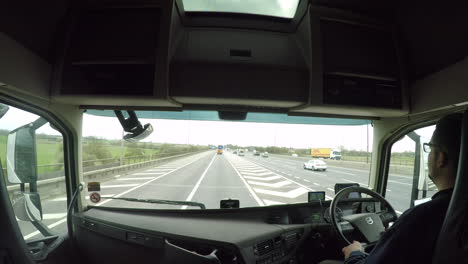 In-cab-view-of-a-HGV-driver-joining-the-M1-motorway-from-the-M6