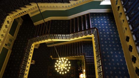 A-young-women-walk-down-the-stairs-at-the-luxurious-hotel-in-the-rural-area-of-Buxton