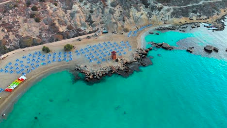 Aerial-drone-shot-approaching-a-lifeguard-tower-on-the-beach-at-Konnos-Bay-in-Europe