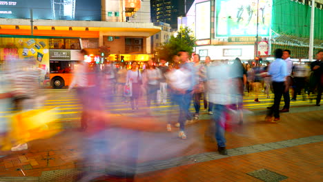 Hong-Kong-China---Circa-Pedestrian-Crossing-People-and-Traffic-Night-Timelapse-on-Hot-Summer-Night-With-Colorful-City-Lights