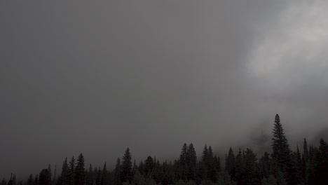 Time-lapse-of-dark-storm-clouds-rolling-through-mountains