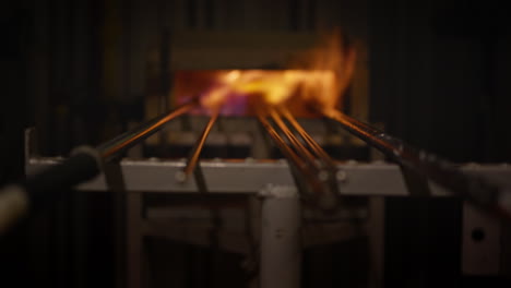 Focus-into-many-glass-rods-in-a-furnace