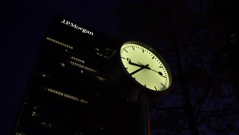 Low-angle-shot-of-JP-Morgan-building-with-close-view-of-a-clock-in-slow-motion