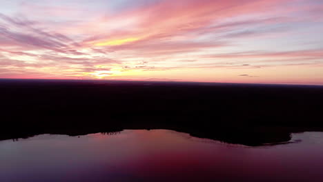 Aerial-Over-Beautiful-Lake-At-Sunset