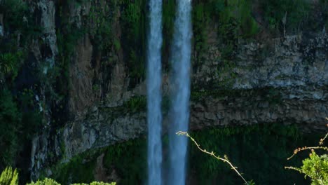 A-vertical-pan-of-a-double-waterfall-in-Maurithius