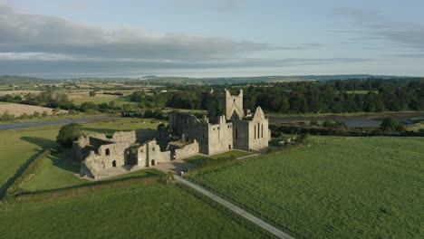Aerial-view,-pan-left,-Dunbrody-Abbey-is-a-former-Cistercian-monastery-in-County-Wexford,-Ireland