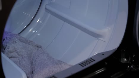 Towels-being-pulled-out-of-a-dryer