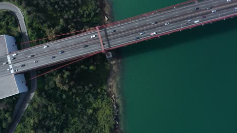 Bird's-eye-view-drone-shot-of-the-Lisbon-25-de-Bbril-Bridge-with-some-traffic