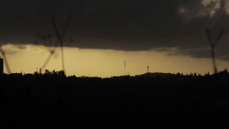 Silhouette-of-Jerusalem-forest-in-a-cloudy-day,-Time-lapse