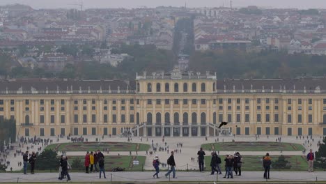 High-above-view-of-Schönbrunn-castle-grounds-and-Vienna-Panorama-on-grey-and-foggy-autumn-day-with-pond-CROP