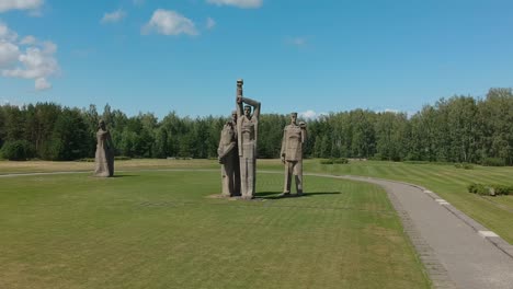 Aerial-long-shot-of-colossal-statues-in-Salaspils-Memorial,-Latvia