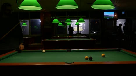 Silhouettes-of-people-at-a-pool-hall