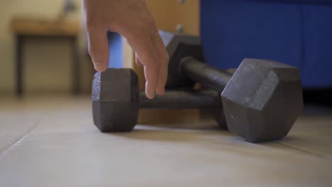 Neglecting-or-passing-on-workout---Man-decides-not-to-pick-up-weights