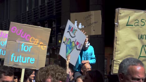 Fridays-for-Future-protestor-holding-up-sign,-Cologne