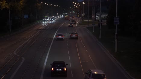 Night-time-vehicle-traffic-on-busy-riverside-street-in-Bratislava