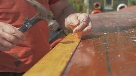Securing-timber-plank-with-pins