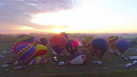 Aerial-View-of-a-Morning-Launch-of-Hot-Air-Balloons-at-a-Balloon-Festival-from-Filling-up-to-Take-Off-as-Seen-by-a-Drone