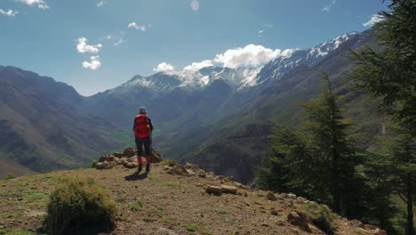 Backpacker-girl-in-High-Atlas-mountains,-Morocco,-circular-pan