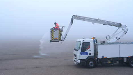 Deicing-truck-is-testing-its-equipment-at-an-airport-apron
