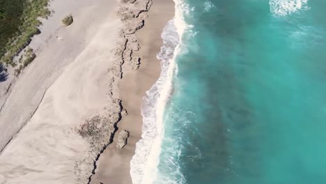 Jensen-Hutchinson-Island-coast-line-turquoise-water-alone-the-shoreline,-drone-view