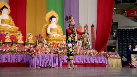 Indonesian-women-dancing-belly-dance-with-candle-holder-on-head-during-Buddha-Birthday-Festival,-Brisbane-2018