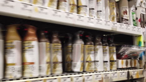 Shelves-of-products-in-the-paint-department-of-a-home-improvement-store