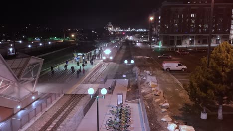 Early-morning-or-darkness-time-lapse-of-a-commuter-train-arriving-at-the-station-and-people-going-to-and-from-work