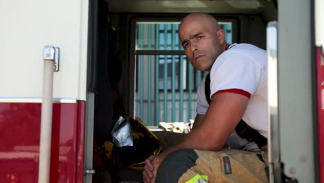 Firefighter-looks-on-with-concern-at-a-fire-at-a-COVID-19-treatment-hospital