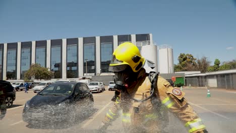 Firefighter-is-sprayed-with-a-fire-hose-to-clean-protective-gear-after-responding-to-a-fire-in-a-COVID-19-hospital