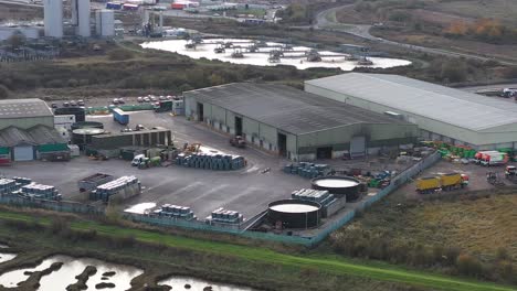 Aerial-view-of-Countrystyle-recycling-yard-at-Ridham-Dock,-Kemsley-with-a-RoRo-Lorry-driving-through