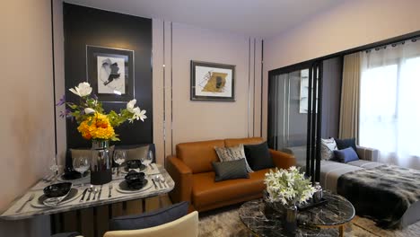 Stylish-Apartment-Walkthrough-Showing-Bedroom,-Living-Area,and-Dining-Area