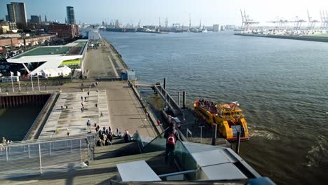 Time-lapse-of-the-harbor-area-of-Hamburg-with-tourists-and-boats-moving-about-on-a-weekend-afternoon