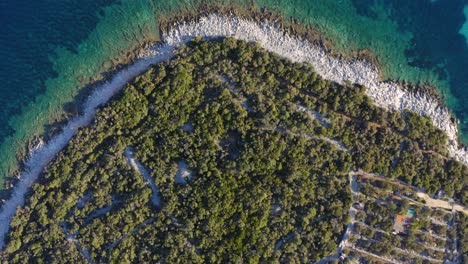 Aerial-top-reveal-of-a-rocky-coast-in-the-mediterranean-island-of-Mali-Losinj