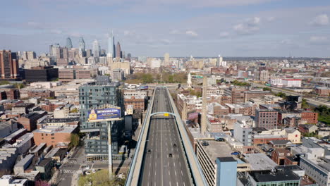Aerial-drone-view-of-nearly-empty-Philadelphia-highway-into-the-city-during-covid-19-coronavirus-lockdown-causing-a-shelter-in-place-order-as-people-stay-home