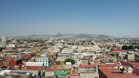 Mexico-City-Neighborhood,-Mountains-in-Background-CDMX,-Drone,-Boom-Jib-Up