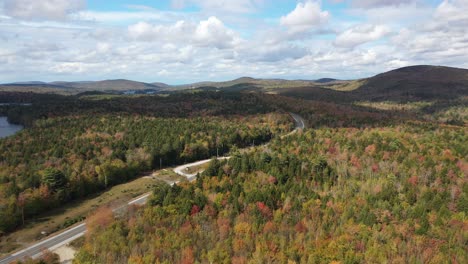 Aerial-View-of-Road-in-Magical-Colorful-Autumn-Landscape-in-American-Countryside-on-Sunny-Day,-Drone-Shot
