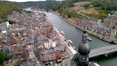 River-Maas-in-Dinant,-Belgium-with-famous-highway-N97-bridge-in-background-filmed-from-above
