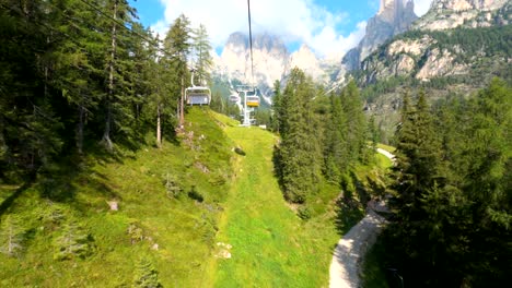 Driving-on-cable-car-in-summer-in-beautiful-Dolomites-mountains