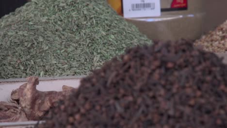 Edible-seeds-and-condiments-on-display-at-the-traditional-spice-market-in-Manama,-Bahrain