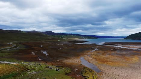Push-in-drone-shot-of-dried-up-scottish-lake-landscape