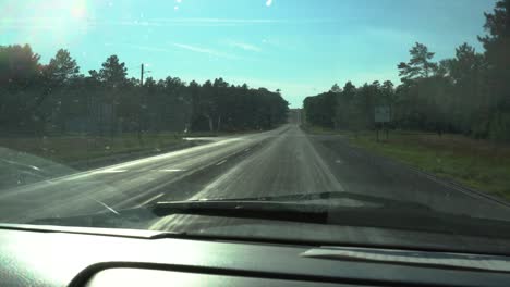 Driving-down-a-highway-in-Traverse-City,-Michigan-in-the-summer-of-2020