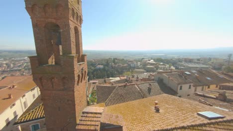 Exterior-Detail-Of-Santa-Croce-Church-Tower-In-Sinalunga,-Tuscany---aerial-drone